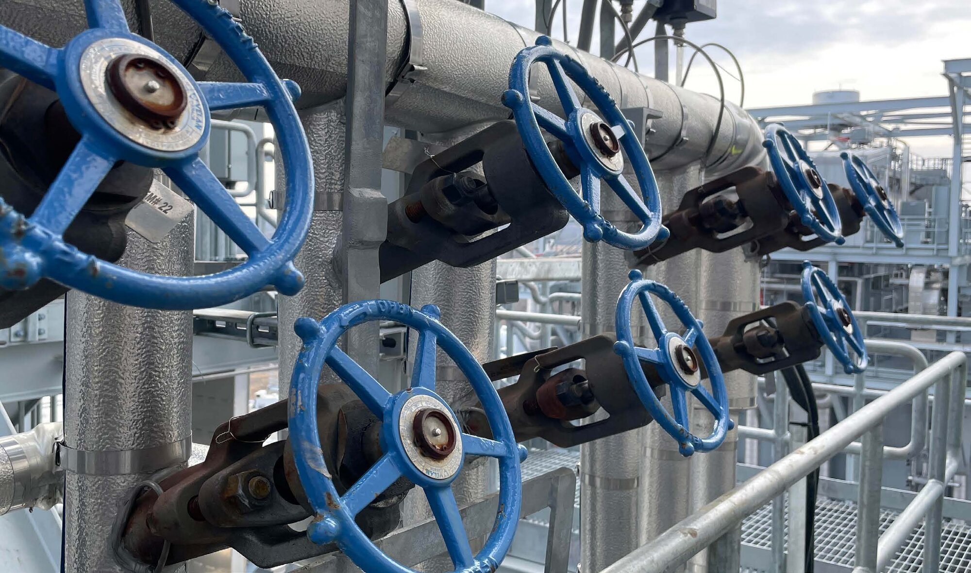 Rows of industrial valves serviced by Dupill Group